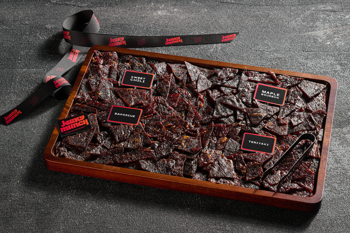 Large Jerky Munch meat board with labeled kosher beef jerky flavors
